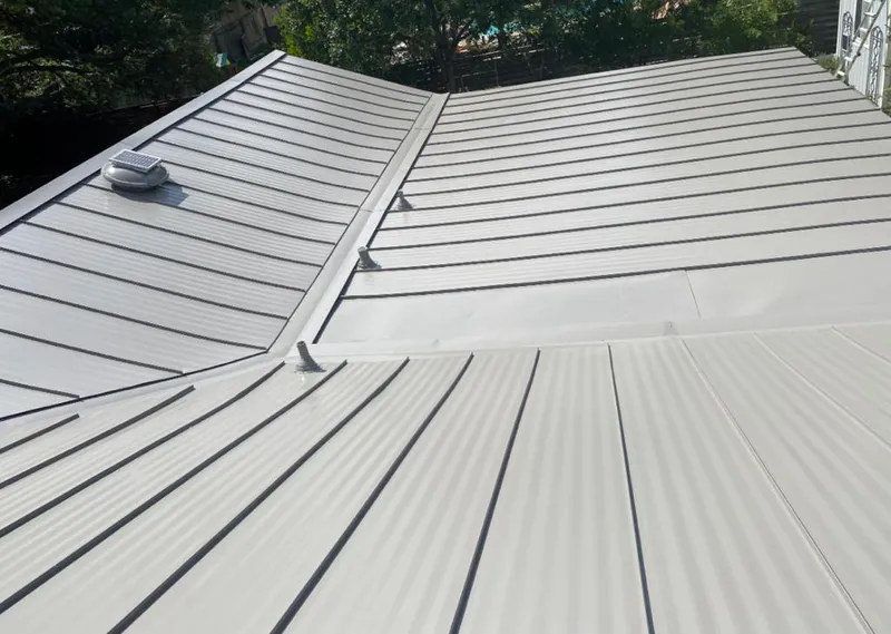 Solar attic fan installed on a metal roof for Roof Ventilation in Ocean City